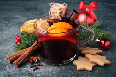 Photo of Christmas composition with aromatic mulled wine on grey table