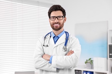 Photo of Medical consultant with glasses and stethoscope in clinic