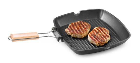 Photo of Grill pan with delicious pork steaks isolated on white