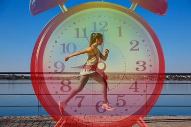 Time to do morning exercises. Double exposure of woman running outdoors and alarm clock