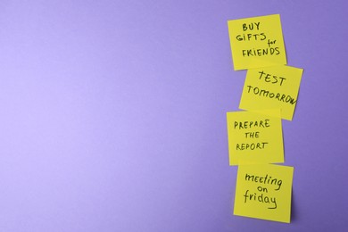 Photo of Many different reminder notes on violet background, flat lay. Space for text