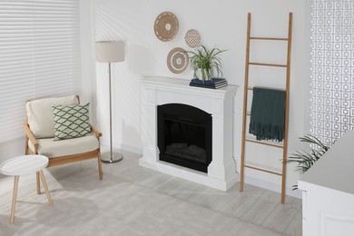 Photo of Wooden ladder near fireplace in stylish room