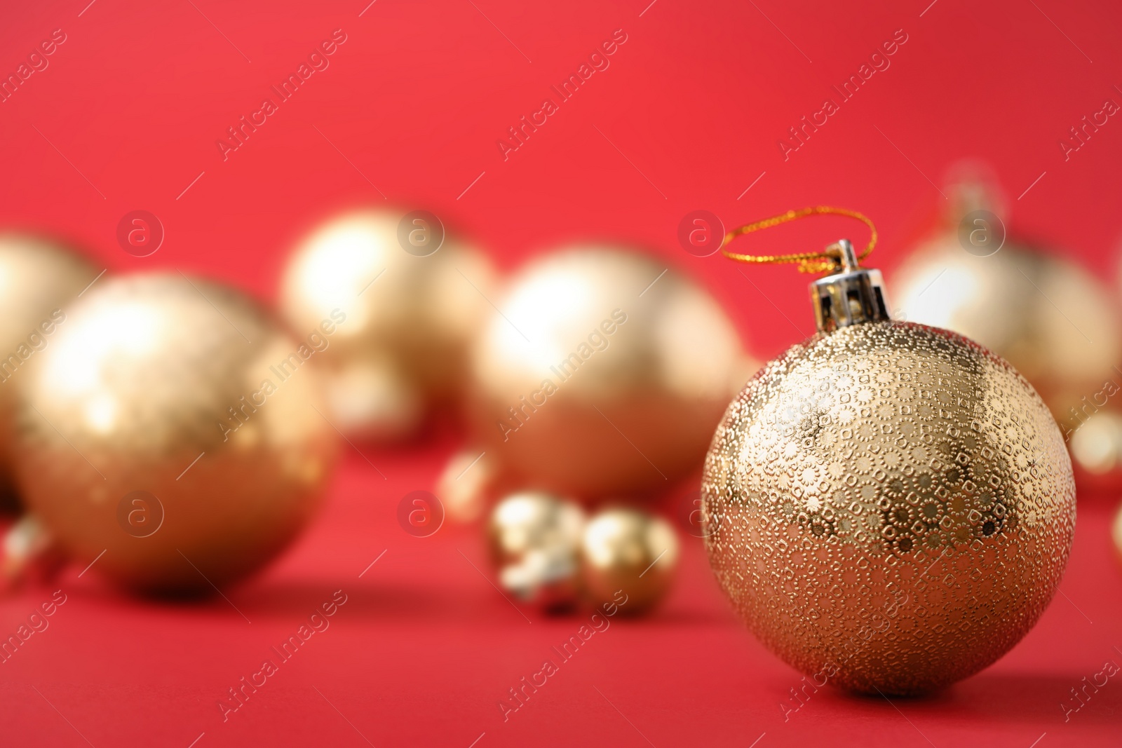 Photo of Beautiful Christmas balls on red background. Space for text