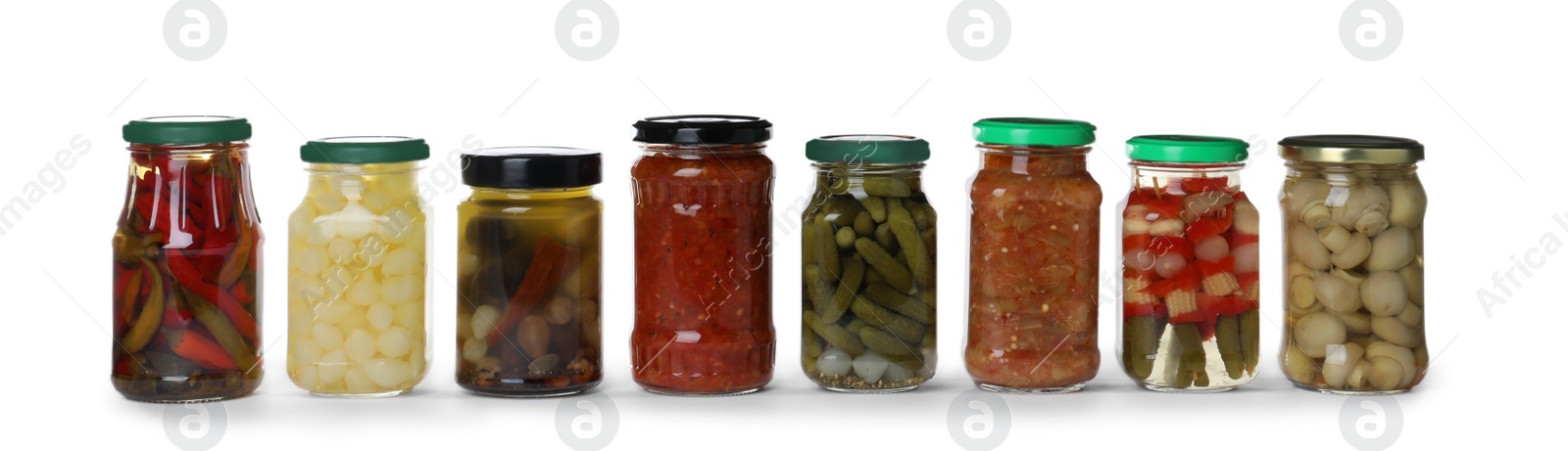Photo of Different jars with pickled vegetables on white background