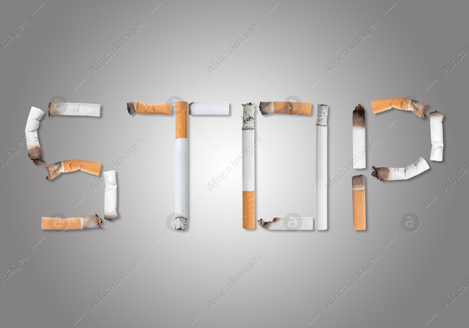 Image of Quitting smoking concept. Word Stop made of burnt cigarettes on light grey background, flat lay