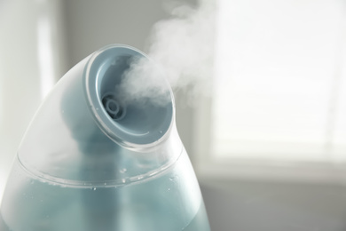 Modern air humidifier at home, closeup view