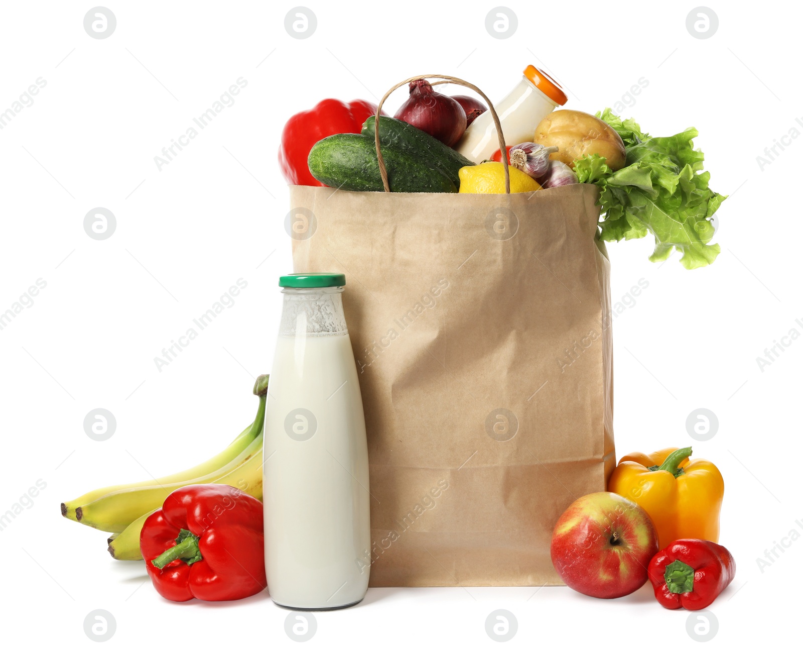 Photo of Paper bag with groceries on white background