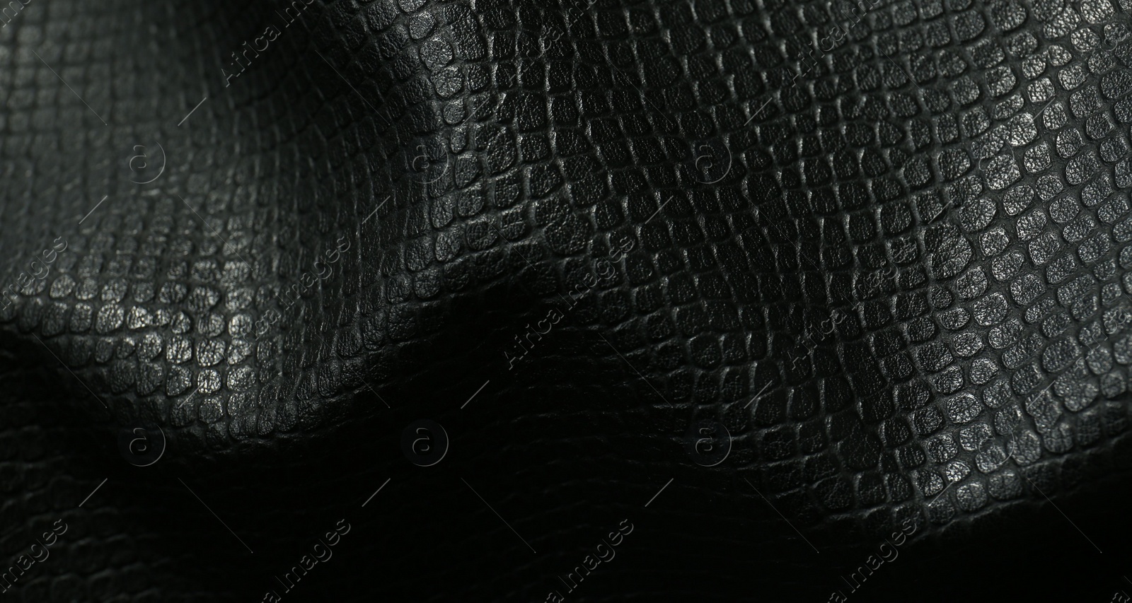 Photo of Black natural leather as background, top view