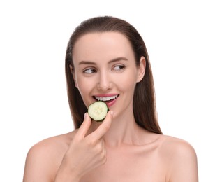 Beautiful woman with piece of cucumber on white background