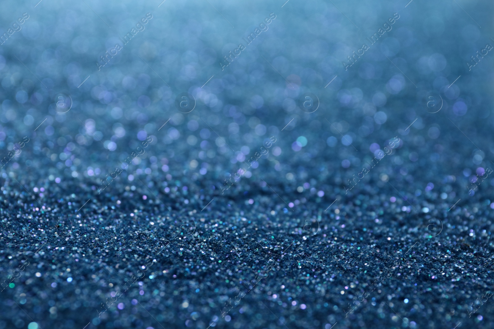 Photo of Shiny light blue glitter as background. Bokeh effect