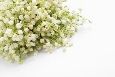 Photo of Beautiful lily of the valley bouquet on white background, closeup