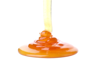 Photo of Pouring sweet fresh honey isolated on white
