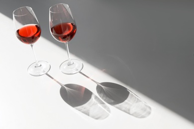 Glasses with delicious wine on table indoors