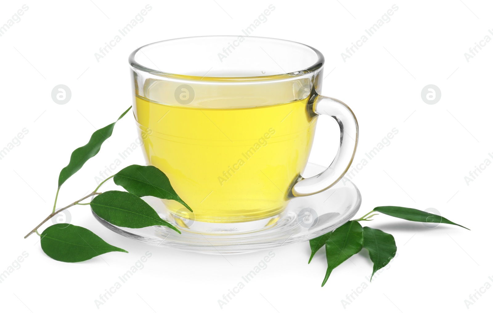 Photo of Fresh green tea in glass cup, leaves and saucer isolated on white