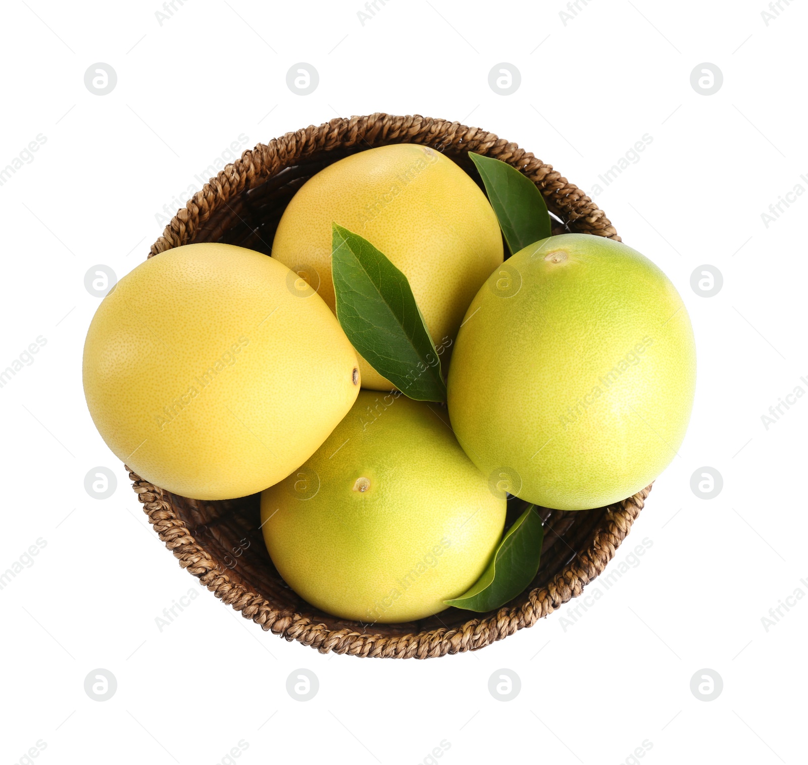 Photo of Wicker bowl with delicious pomelos isolated on white, top view