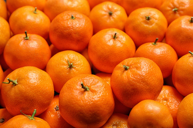 Delicious fresh ripe juicy tangerines as background