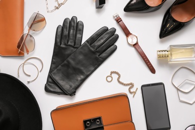 Photo of Flat lay composition with stylish black leather gloves, shoes and accessories on white background