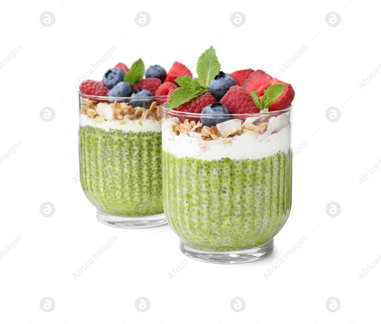 Photo of Tasty matcha chia pudding with oatmeal and berries on white background. Healthy breakfast