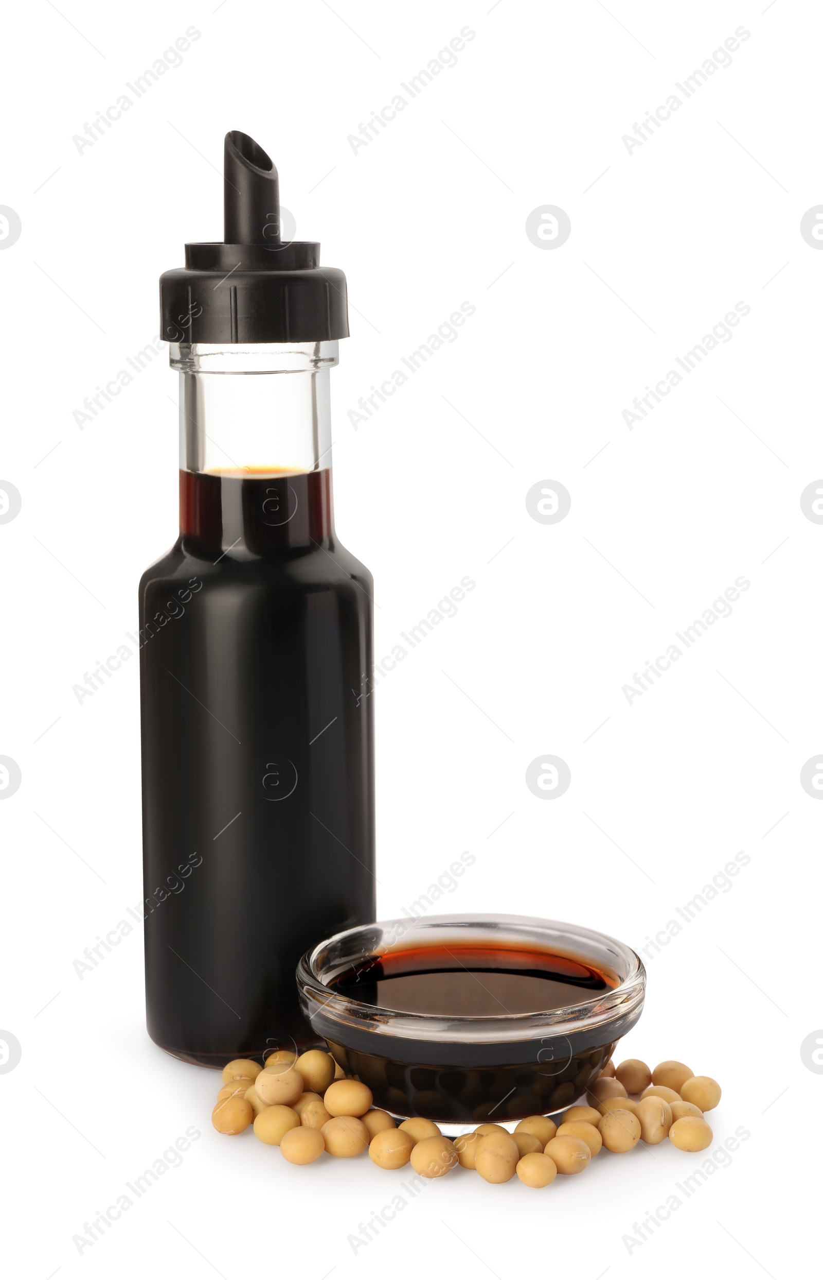 Photo of Natural soy sauce and soybeans on white background