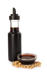 Natural soy sauce and soybeans on white background