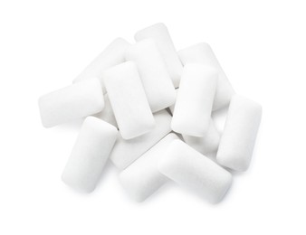 Photo of Heap of chewing gum pieces on white background, top view