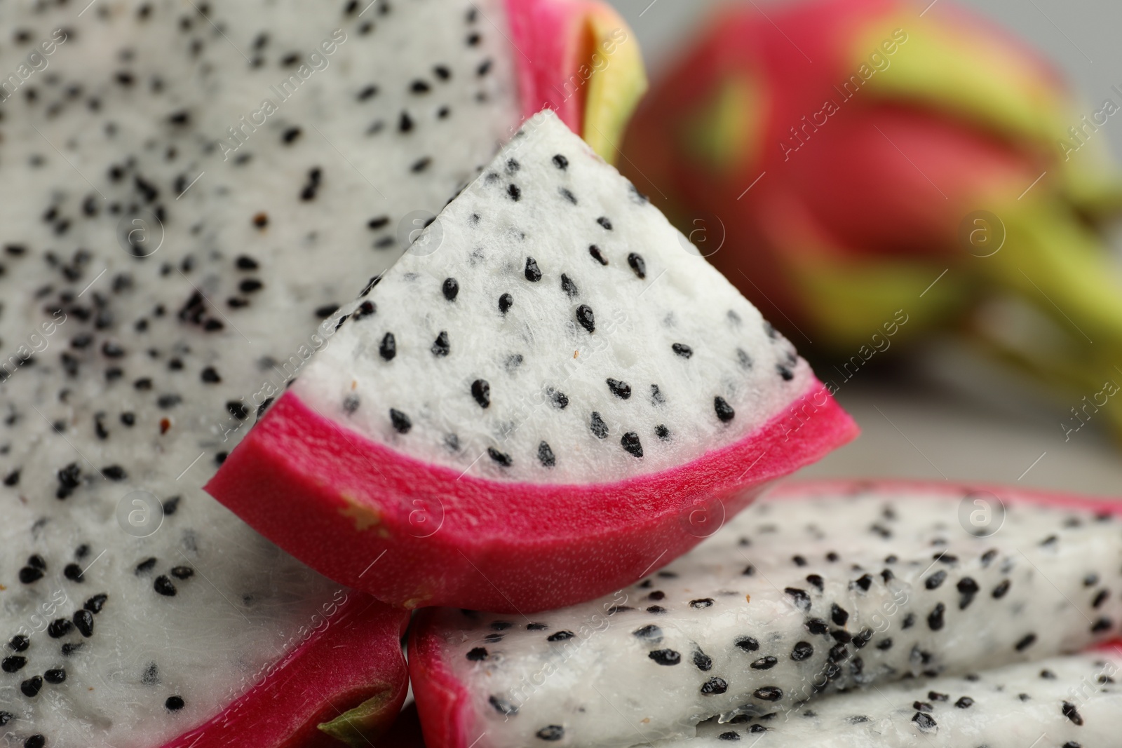 Photo of Slices of delicious ripe dragon fruit (pitahaya), closeup