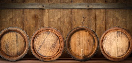 Image of Wooden barrels on shelf, space for text. Banner design