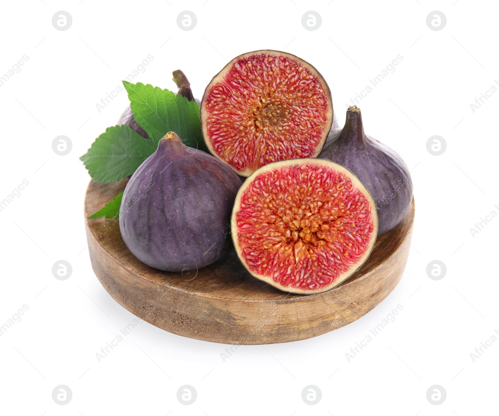 Photo of Wooden plate with whole and cut fresh purple figs isolated on white