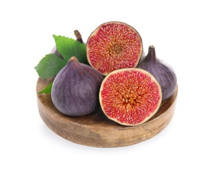 Wooden plate with whole and cut fresh purple figs isolated on white