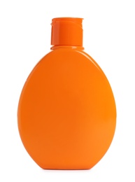 Orange bottle with sun protection body cream on white background. Cosmetic product