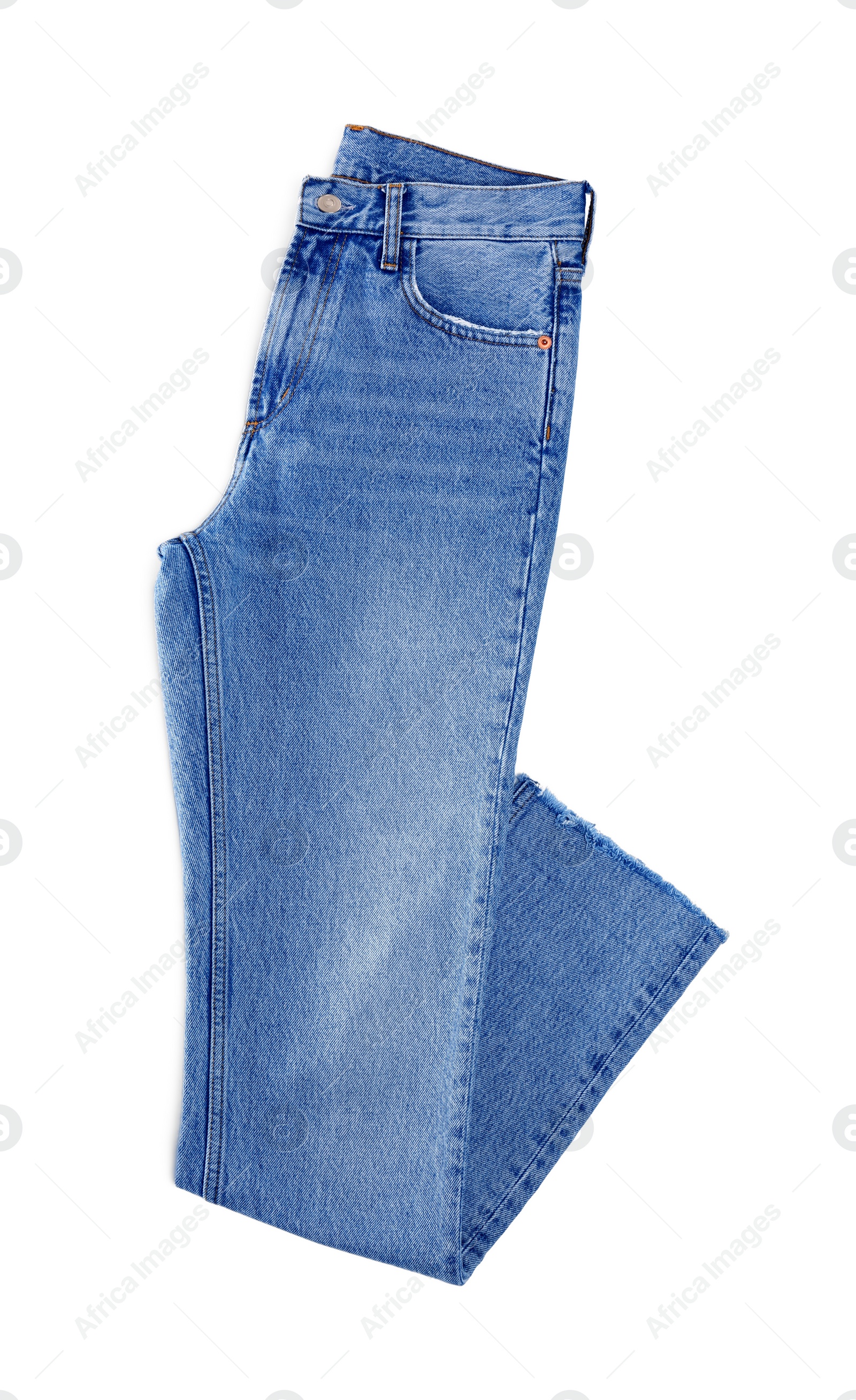 Photo of Light blue jeans isolated on white, top view. Stylish clothes