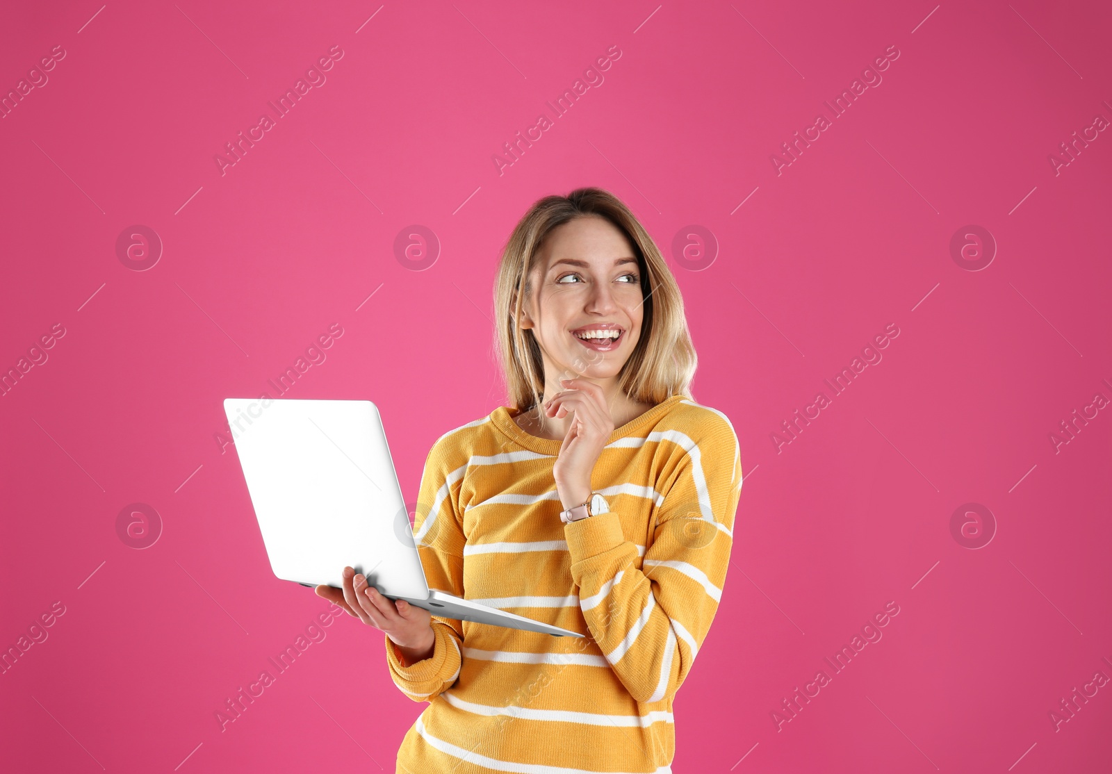 Photo of Portrait of young woman in casual outfit with laptop on color background