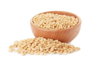 Pine nuts and bowl on white background