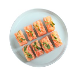 Tasty sushi rolls with salmon on white background, top view