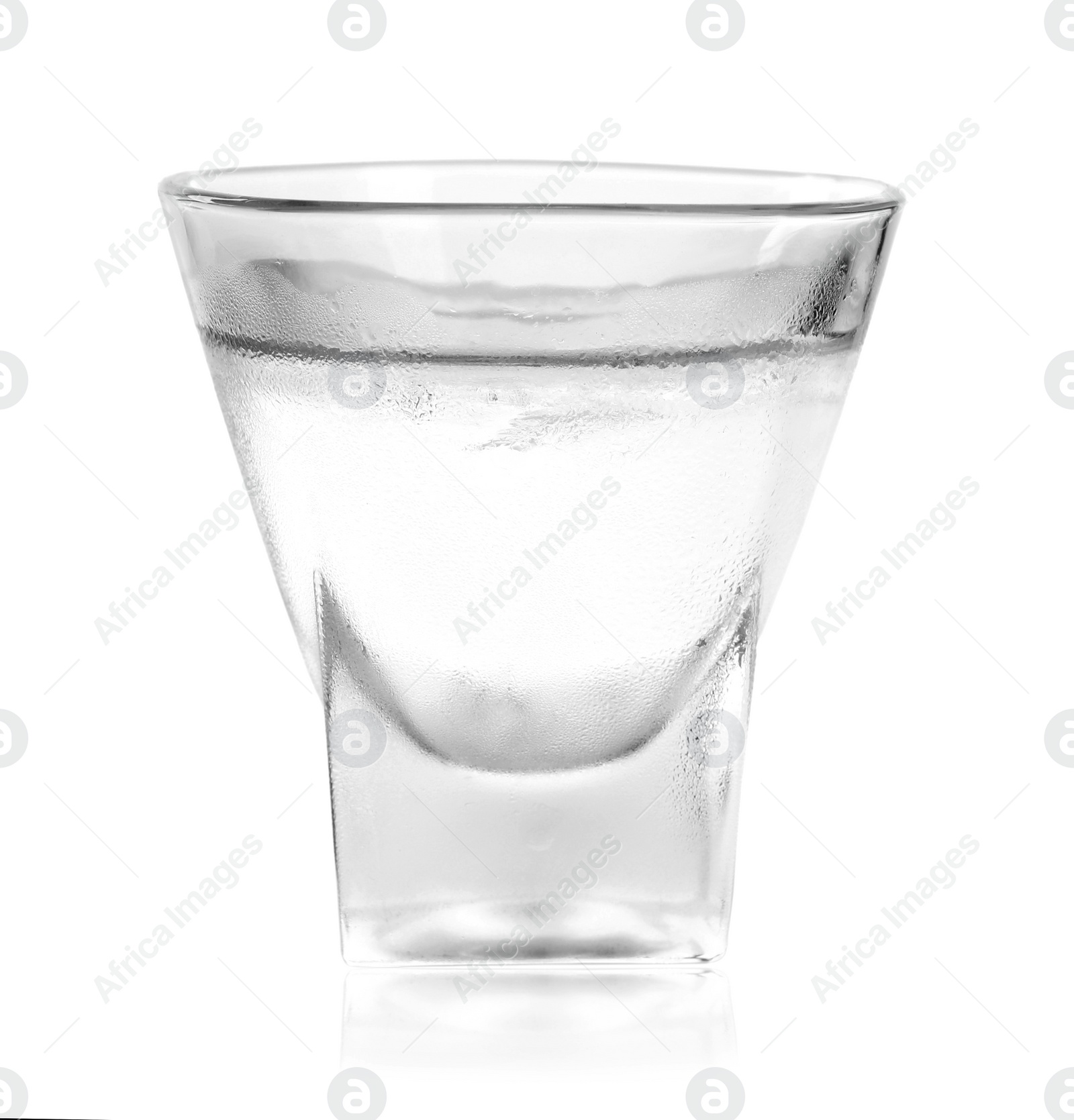 Photo of Shot glass of vodka on white background. Alcoholic drink