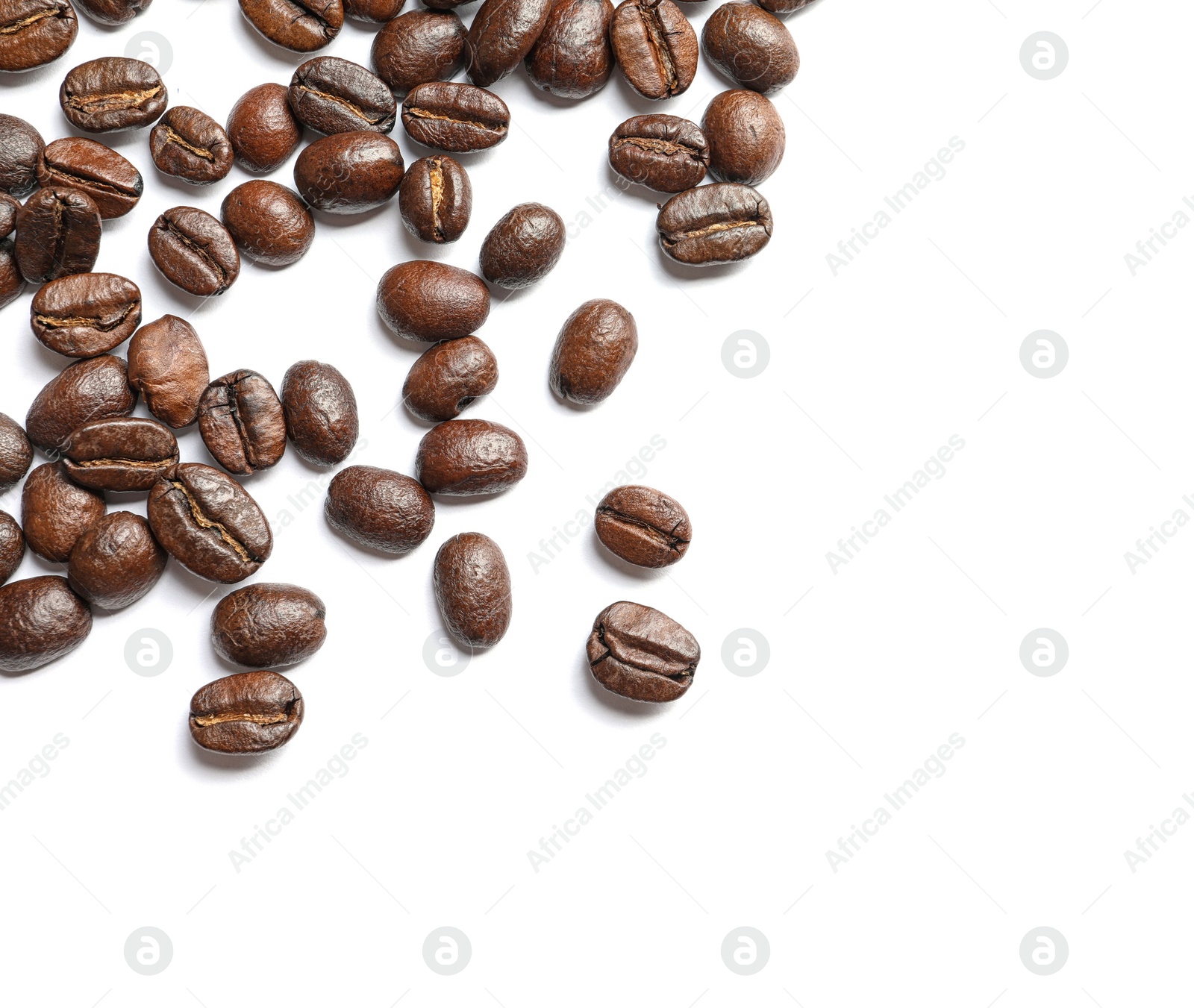 Photo of Roasted coffee beans on white background, top view