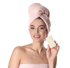 Young woman with soap bar on white background