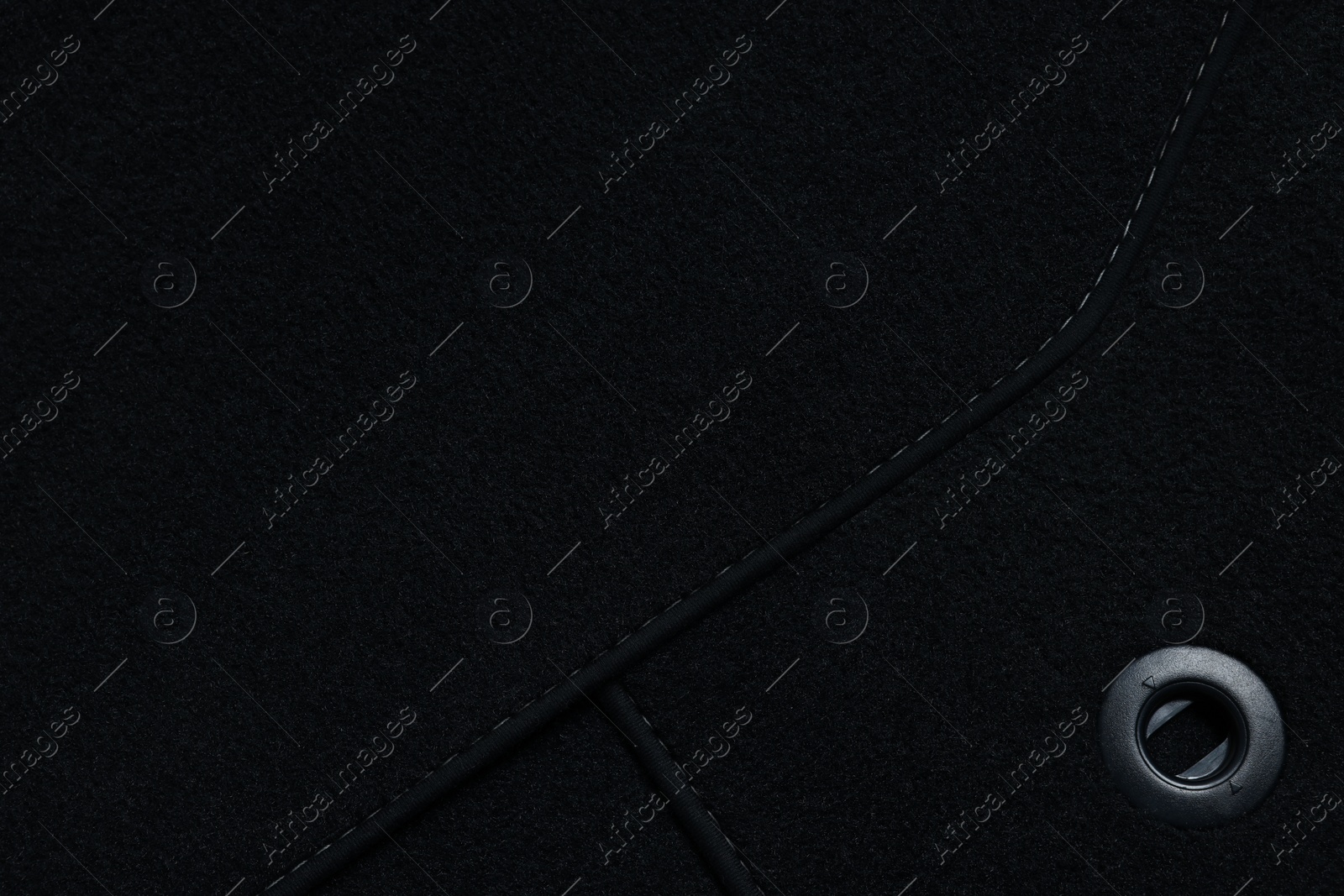 Photo of Black car floor carpets as background, closeup view