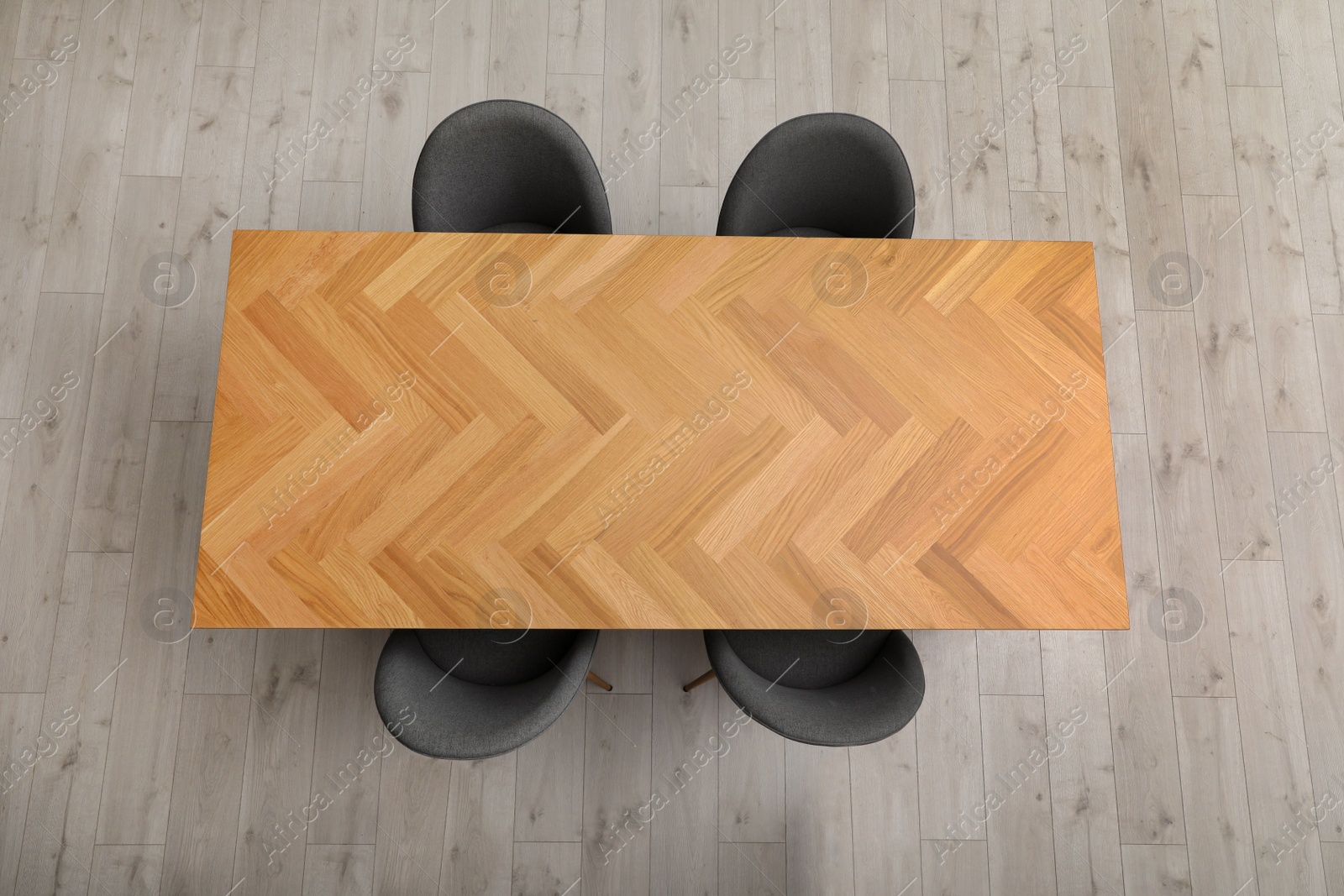 Photo of Wooden table and grey chairs indoors, top view