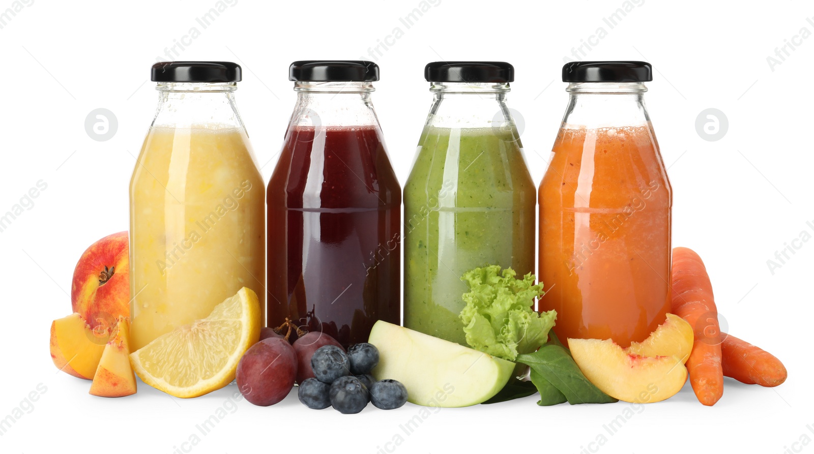 Photo of Bottles of delicious juices and fresh fruits on white background