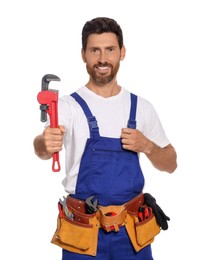 Professional plumber with pipe wrench and tool belt on white background