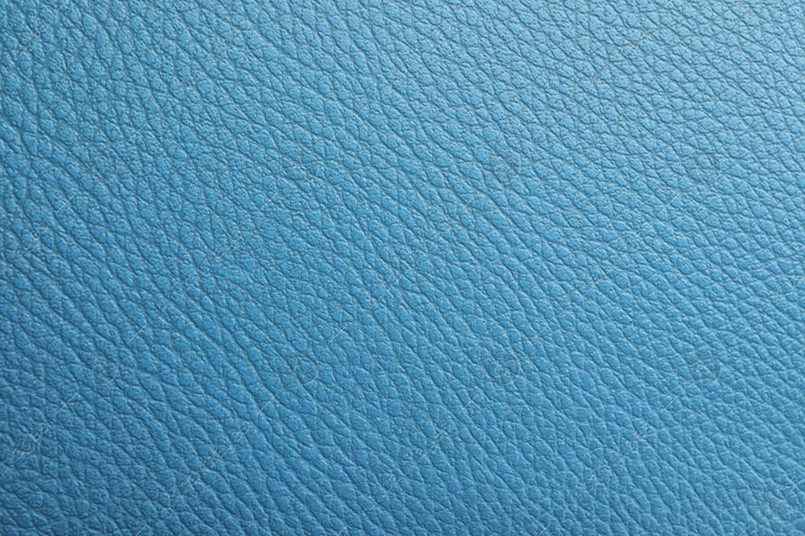 Photo of Texture of blue leather as background, closeup