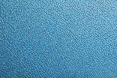 Photo of Texture of blue leather as background, closeup