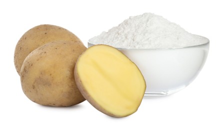 Glass bowl of starch and fresh raw potatoes on white background