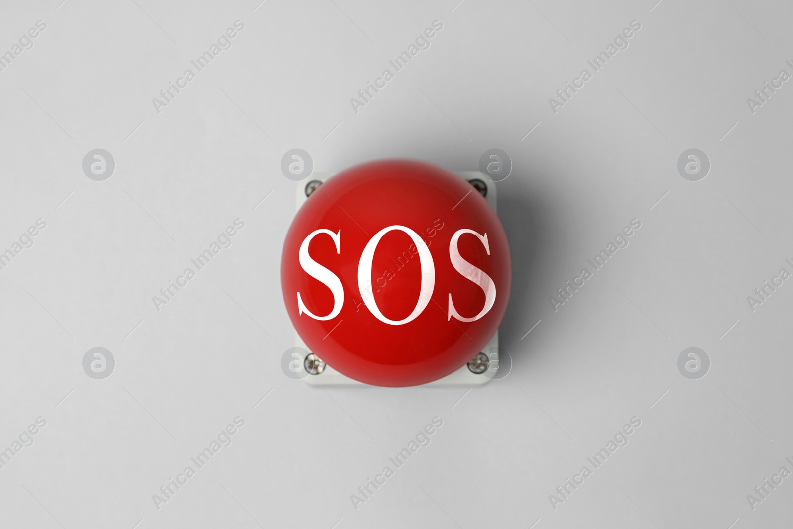 Image of Red SOS button on white background. Space for text