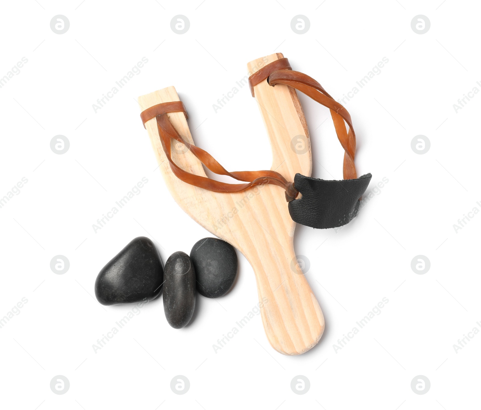 Photo of Wooden slingshot with stones isolated on white, top view