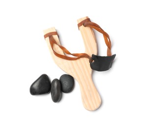 Photo of Wooden slingshot with stones isolated on white, top view