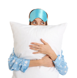 Photo of Beautiful woman with pillow and sleep mask on white background. Bedtime