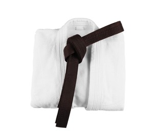 Martial arts uniform with brown belt isolated on white, top view