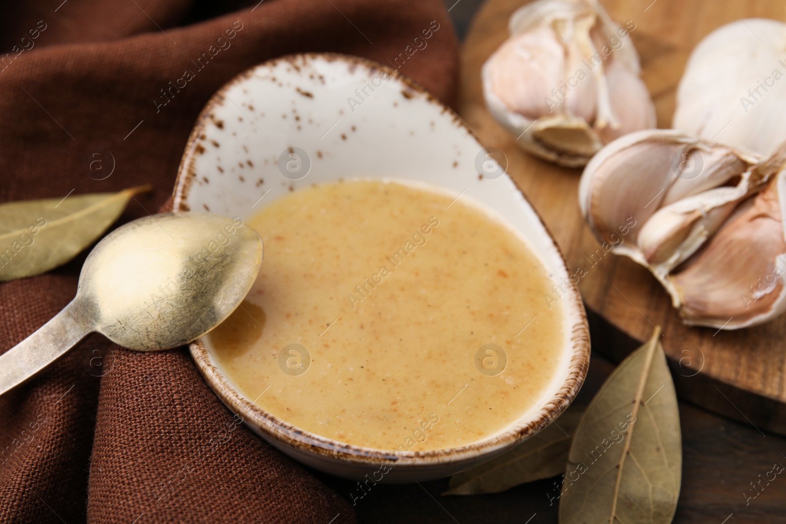 Photo of Delicious turkey gravy served on table, closeup